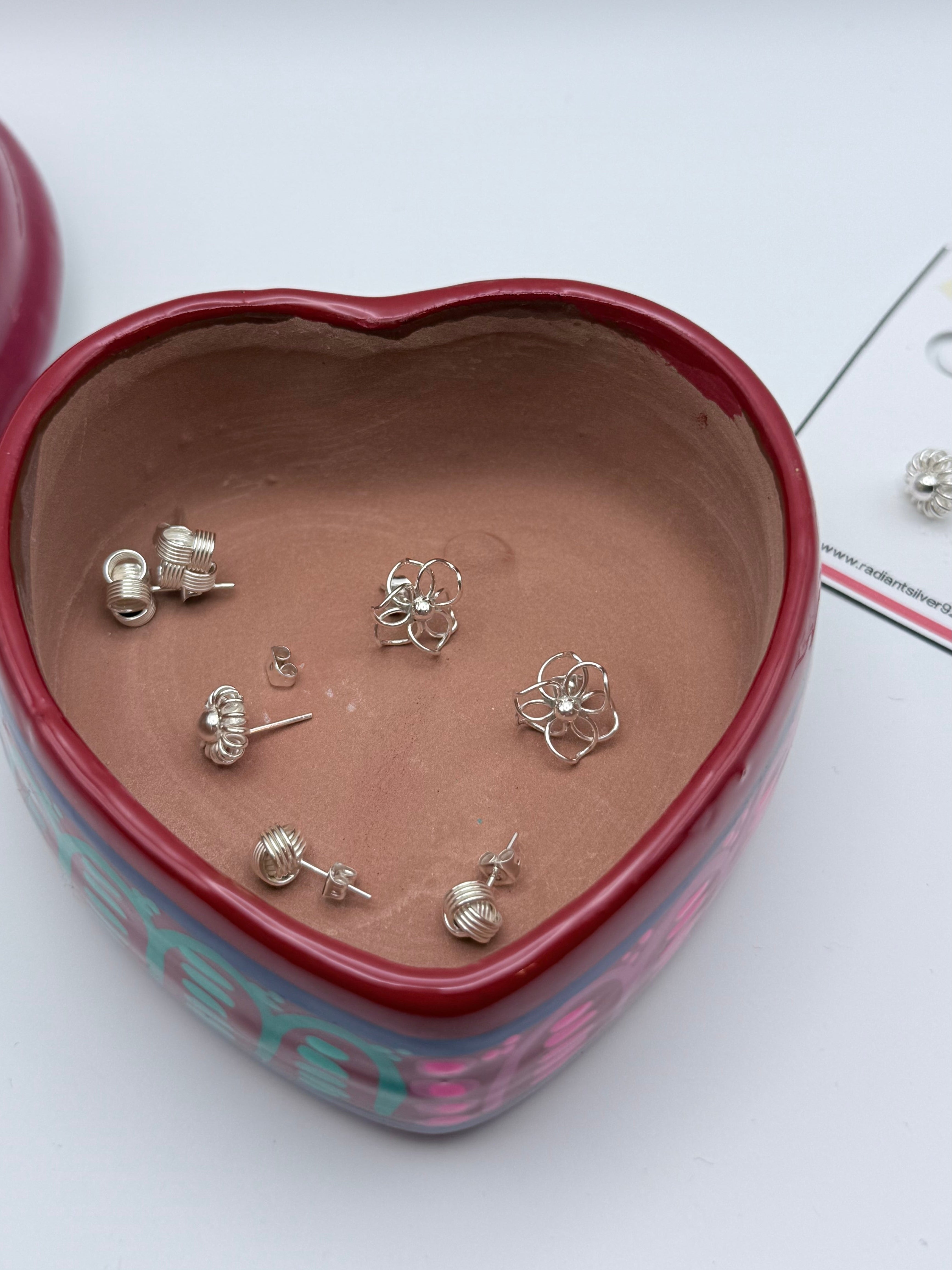 Jewelry box with silver earrings on a white background