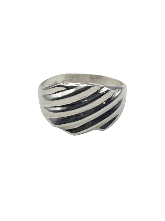 Silver ring with stripes on a white surface