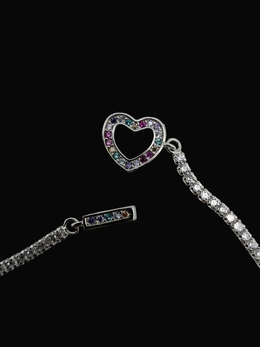 Necklace with heart-shaped and rectangular pendant on a light gray background