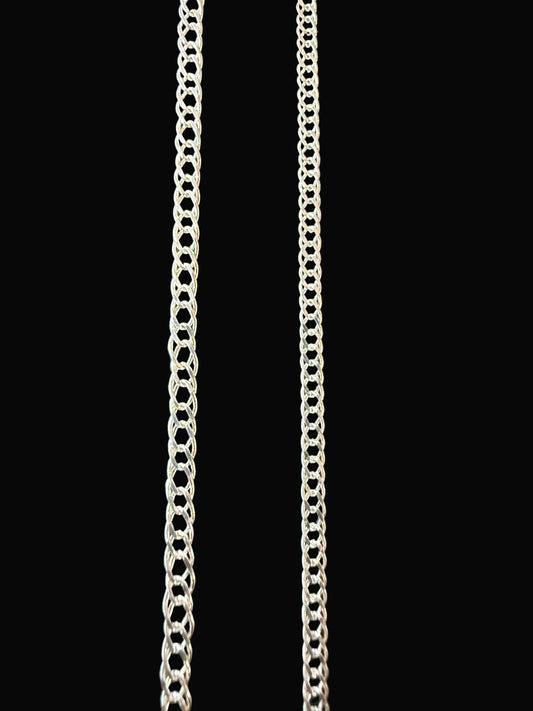 Two silver chains on a black textured surface