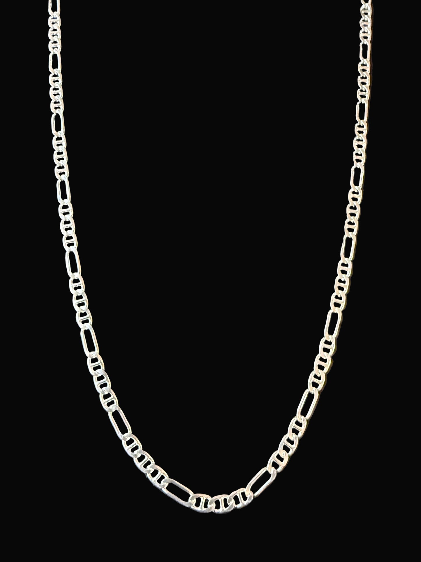 Silver chain on a dark surface